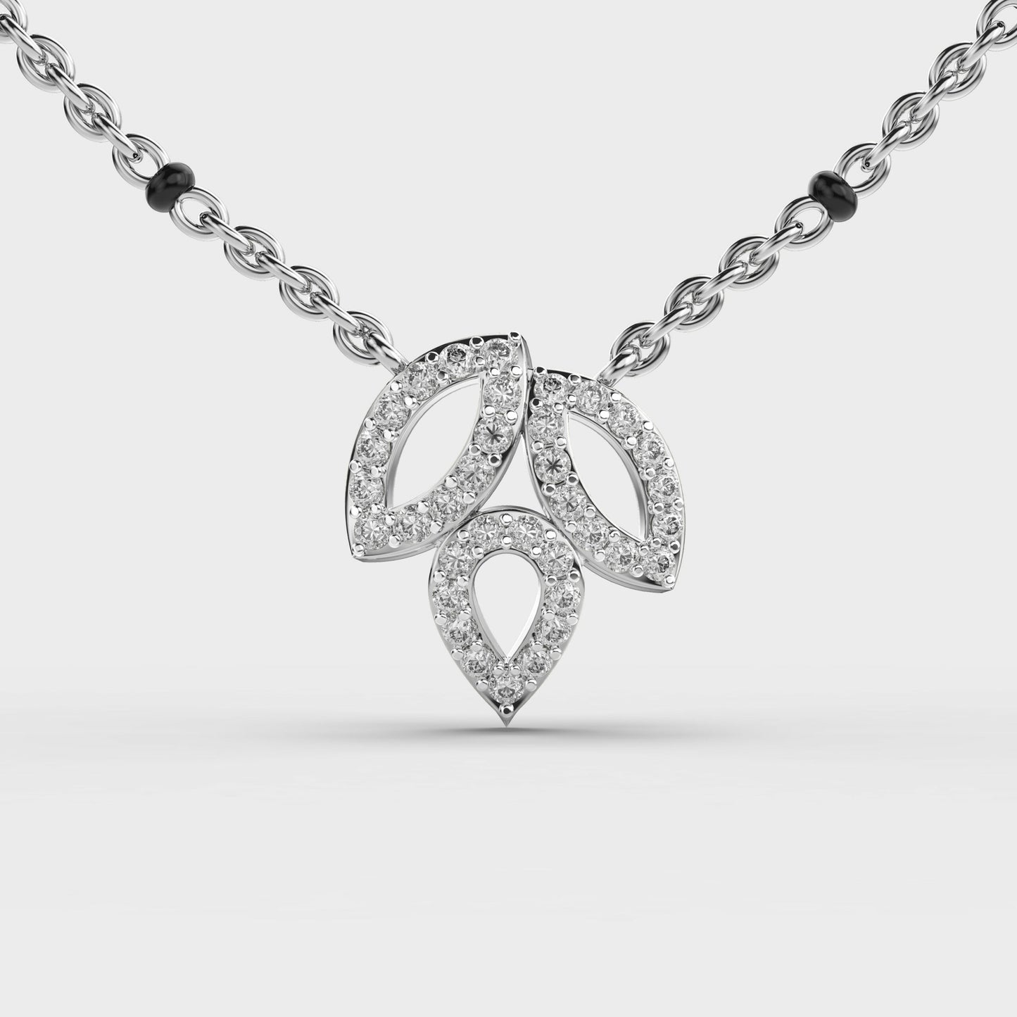 trio leaf diamond encrusted pendant